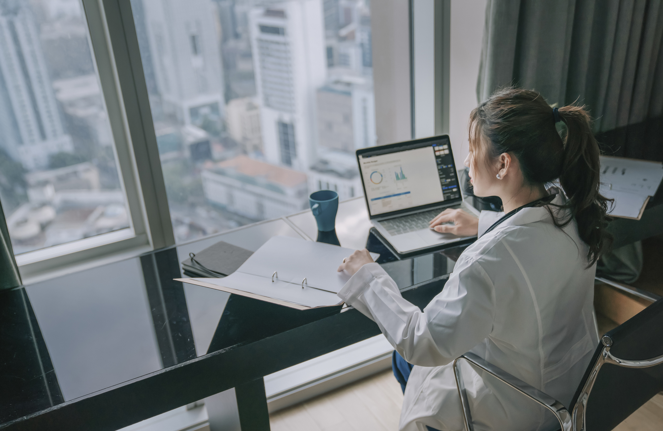 photograph of woman at a laptop