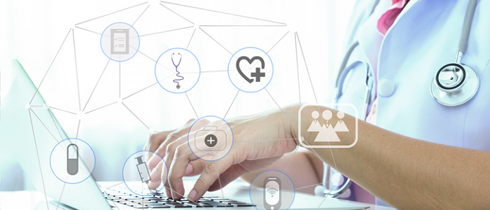 person typing on a keyboard with graphic overlay showing medical symbols