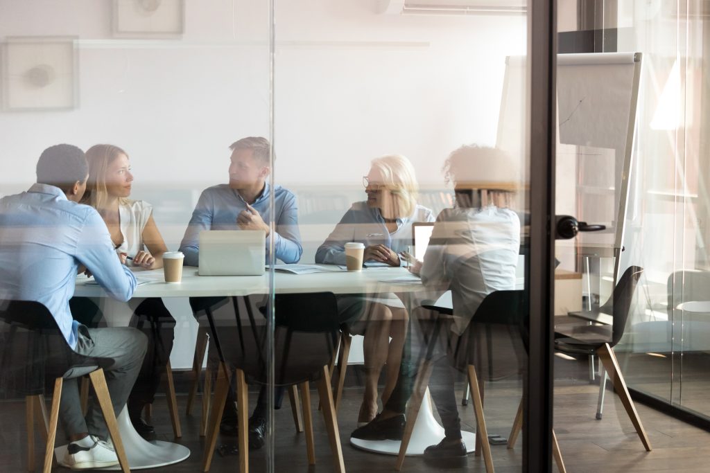 People in a conference room having a discussion