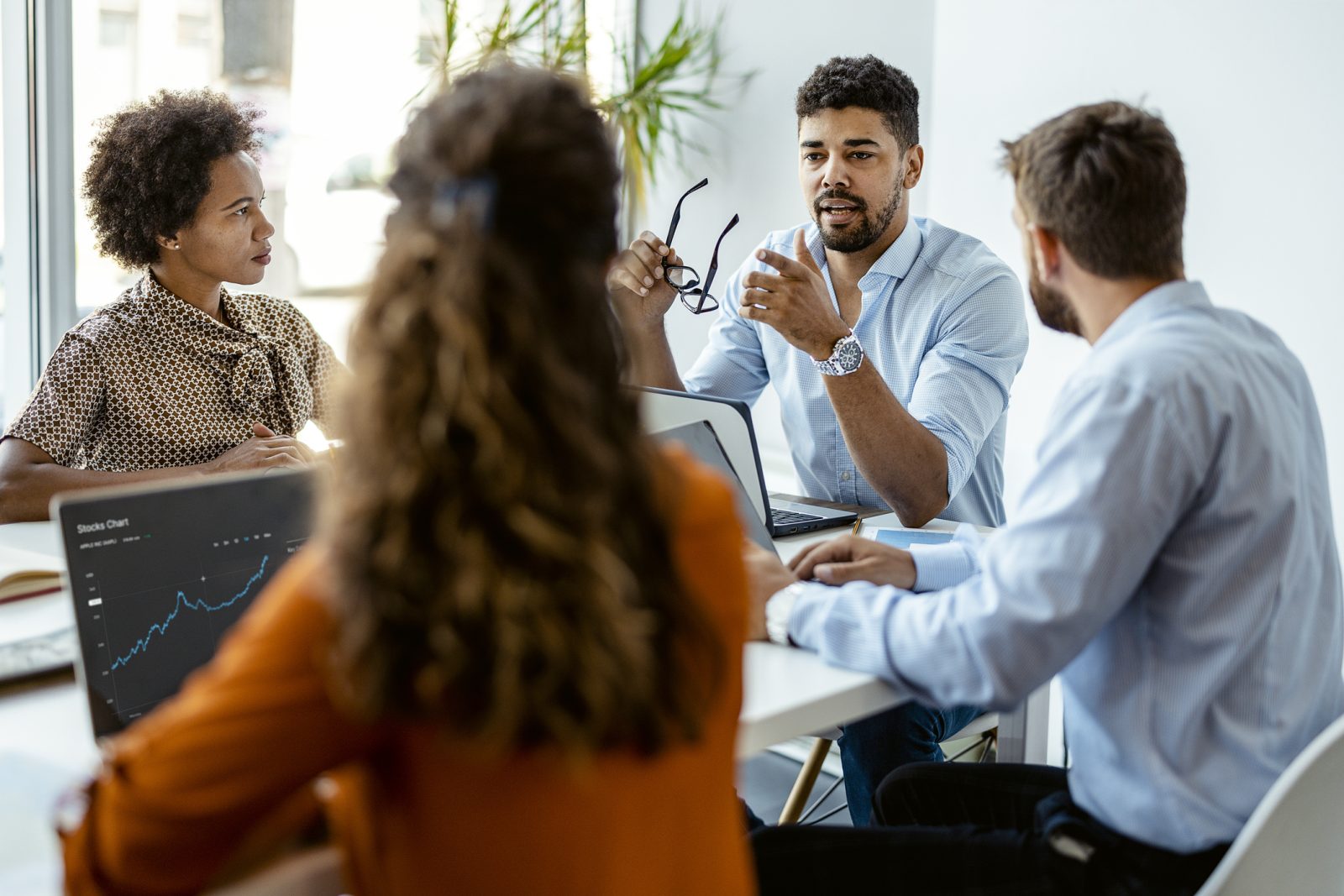people sitting around a table having a conversation